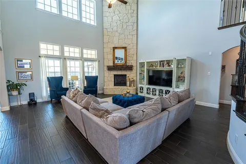 a living room with furniture flat screen tv and a fireplace