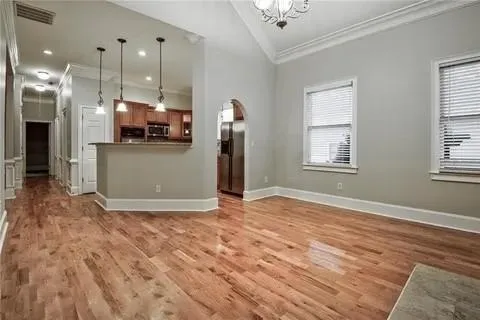 a view of a room with kitchen appliances and furniture