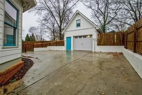a view of a house with a yard covered in snow