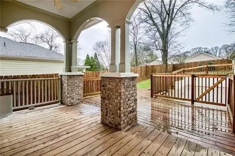 a view of a balcony with wooden floor
