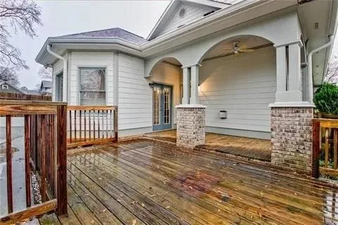 a view of a house with wooden fence