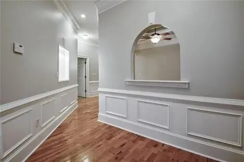 a view of a hallway view with wooden floor and staircase