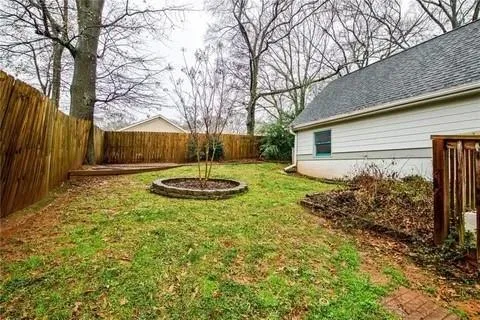 a backyard of a house with lots of green space