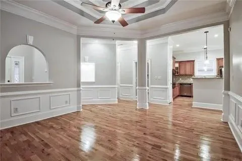 a view of a kitchen with wooden cabinet and a refrigerator a sink