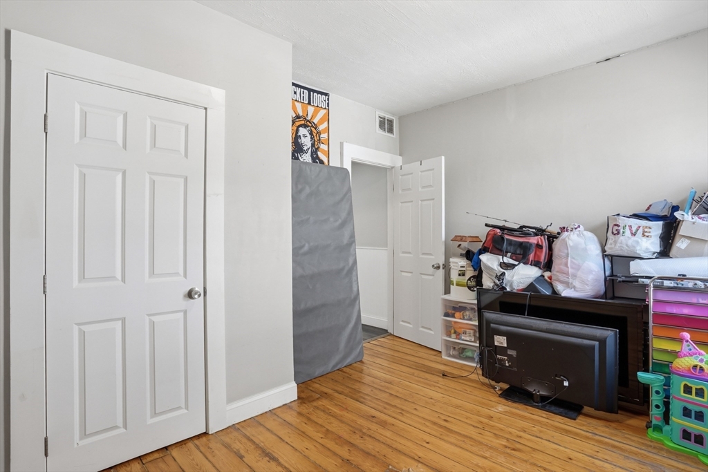 196 Irving Street Fall River, MA 02723 - Photo 20 of 34 a room with furniture and wooden floor