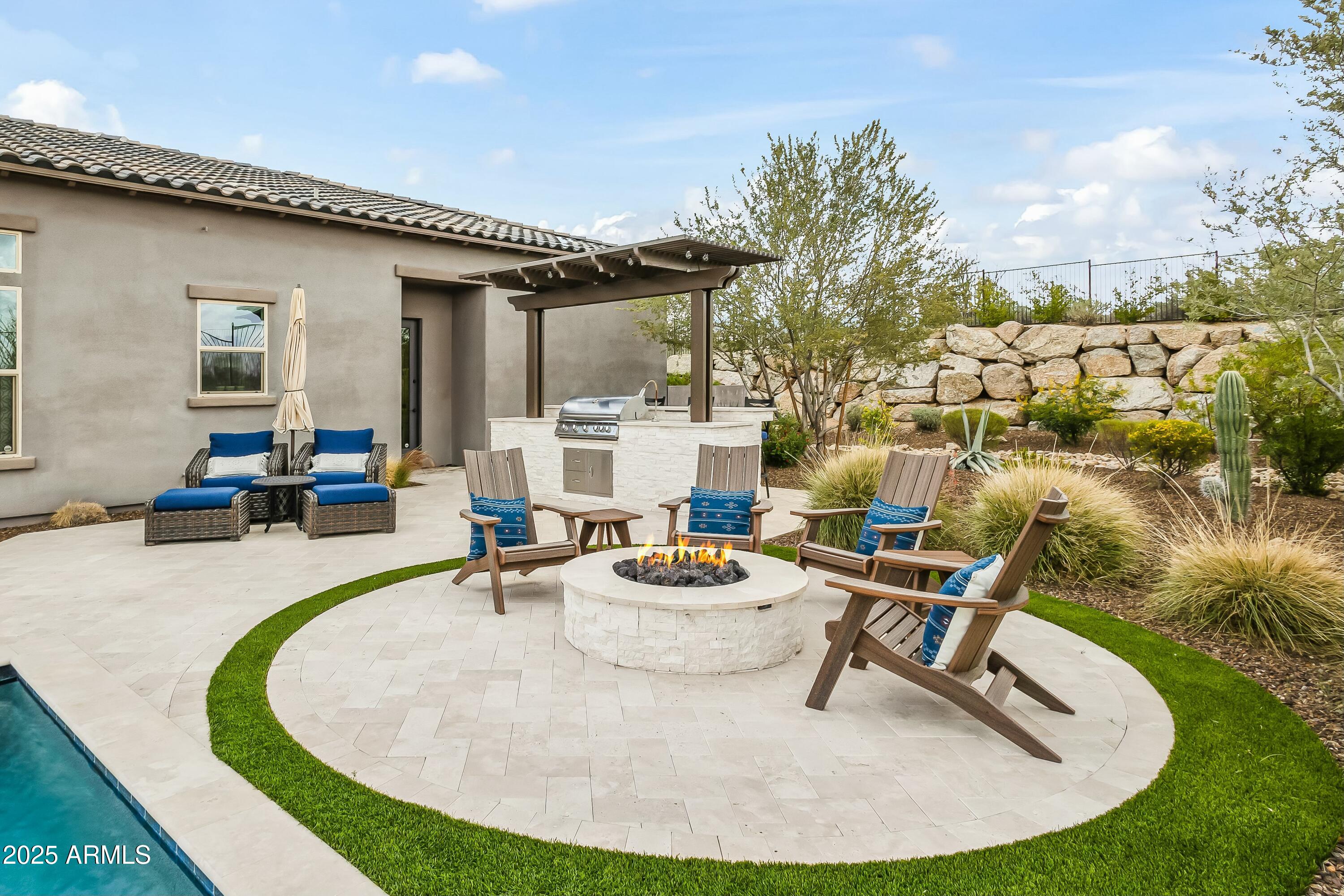 8769 East Granite Pass Road Scottsdale, AZ 85266 - Photo 18 of 23 a swimming pool with outdoor seating and yard