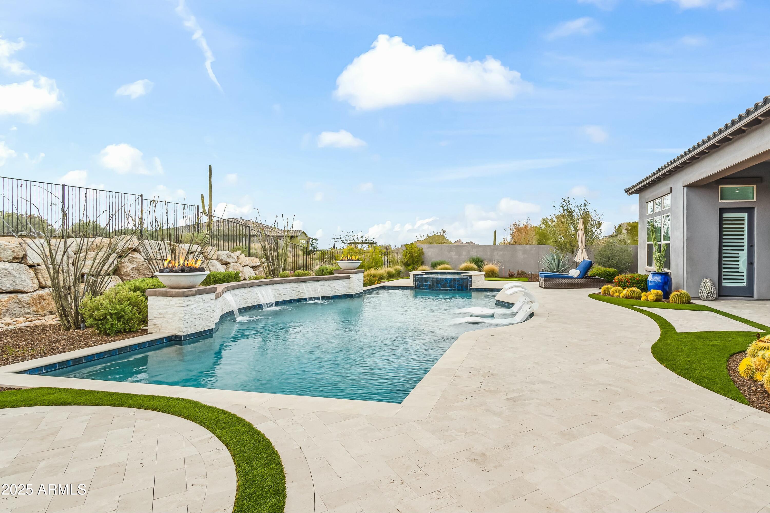8769 East Granite Pass Road Scottsdale, AZ 85266 - Photo 19 of 23 a view of a swimming pool with outdoor seating