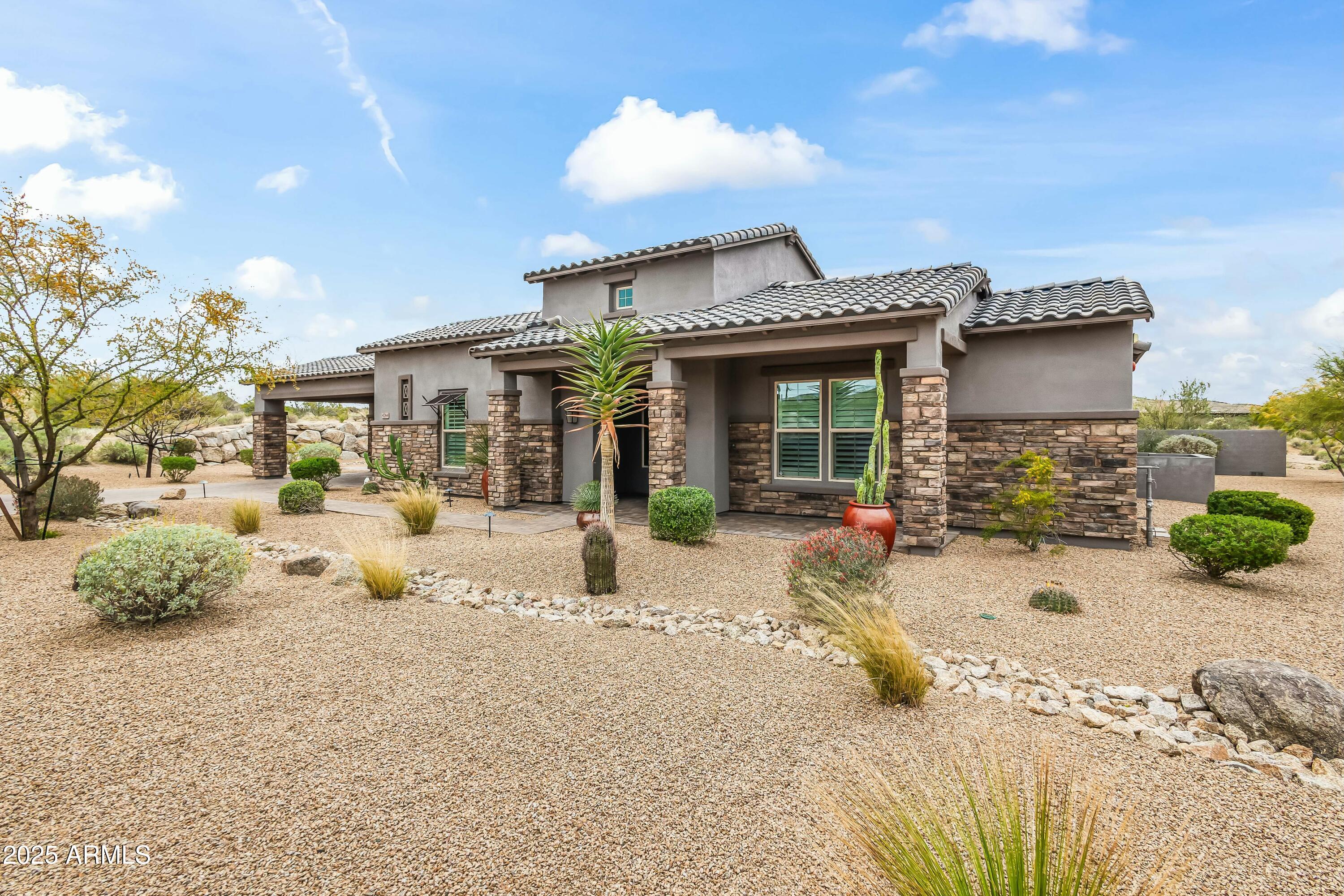 8769 East Granite Pass Road Scottsdale, AZ 85266 - Photo 20 of 23 a view of a house with patio outdoor seating