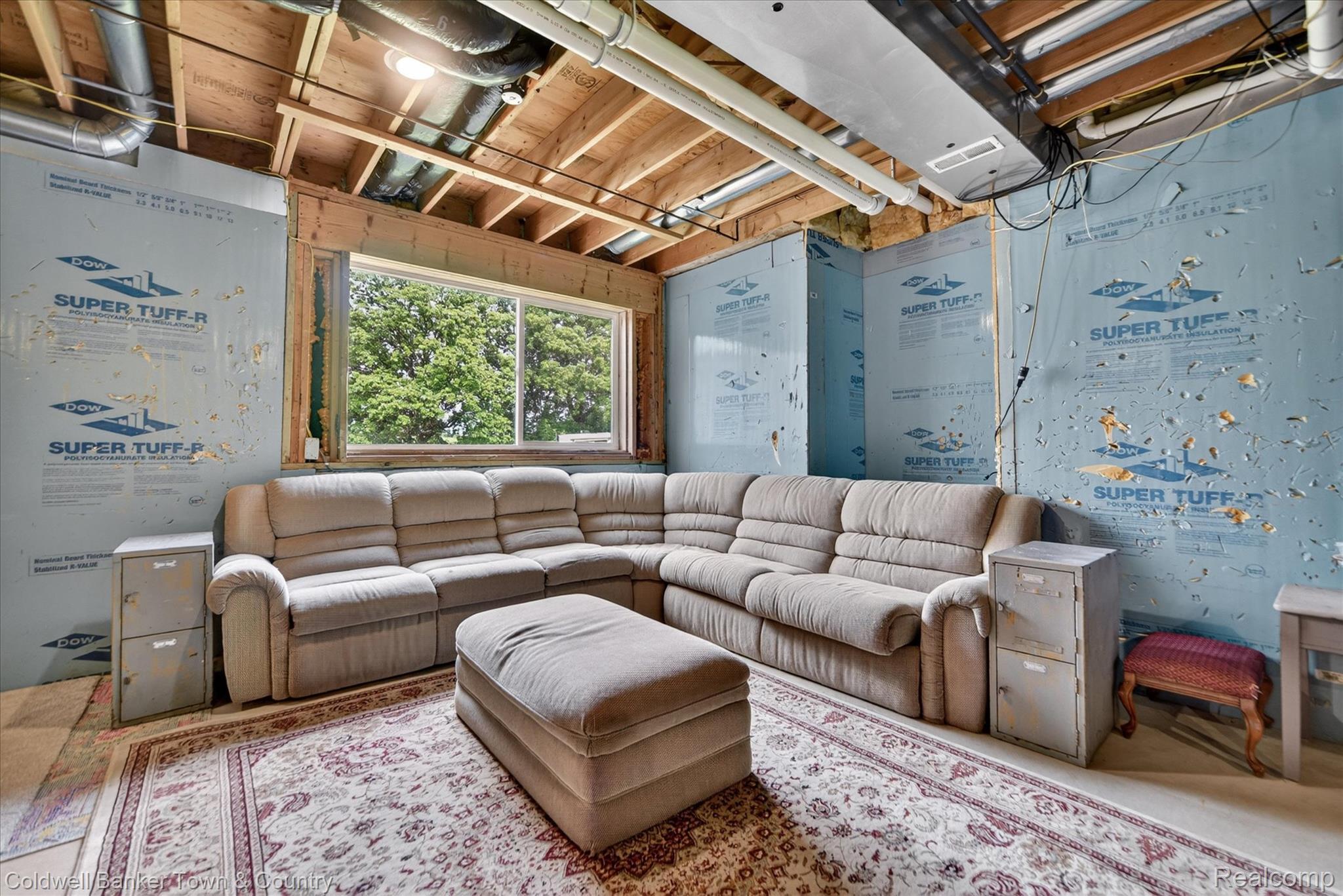 918 Gray Fox Court Howell, MI 48843 - Photo 45 of 84 Lower level space featuring exposed ceiling joists and visible ductwork