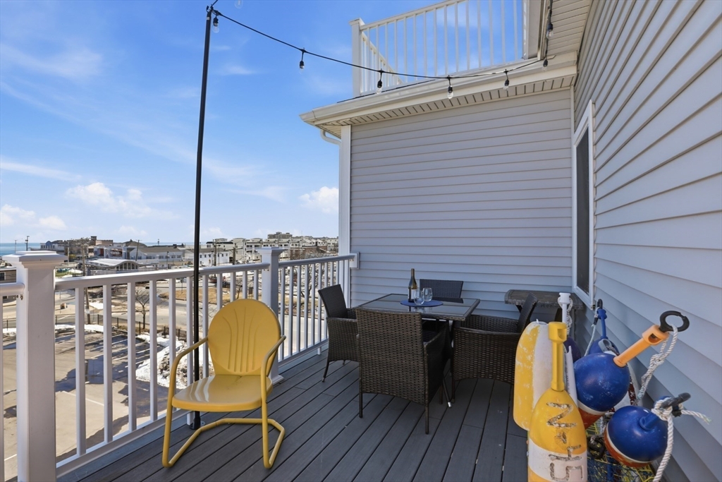 233 Beach Road, Unit A10 Salisbury, MA 01952 - Photo 13 of 39 a view of a balcony with chairs