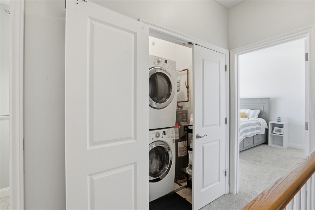 233 Beach Road, Unit A10 Salisbury, MA 01952 - Photo 16 of 39 a view of a storage & utility room with washer and dryer