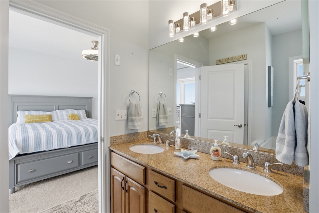 233 Beach Road, Unit A10 Salisbury, MA 01952 - Photo 23 of 39 a en suite bathroom with a double vanity sink and a mirror