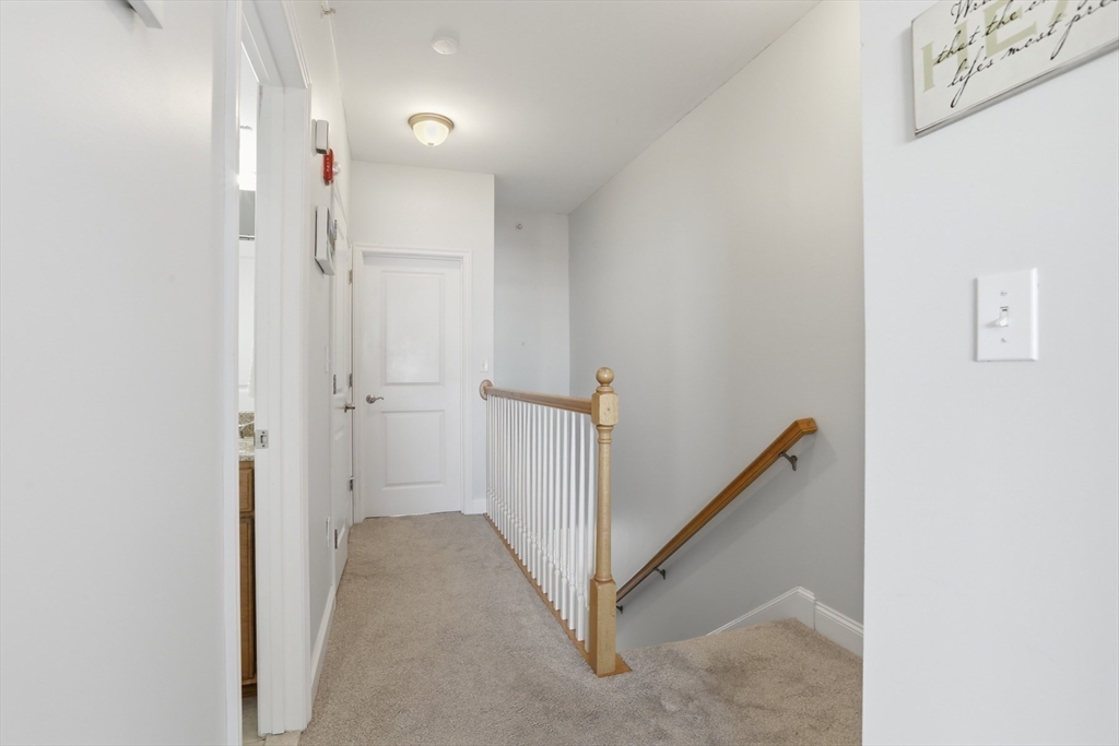233 Beach Road, Unit A10 Salisbury, MA 01952 - Photo 26 of 39 a view of a hallway with white walls