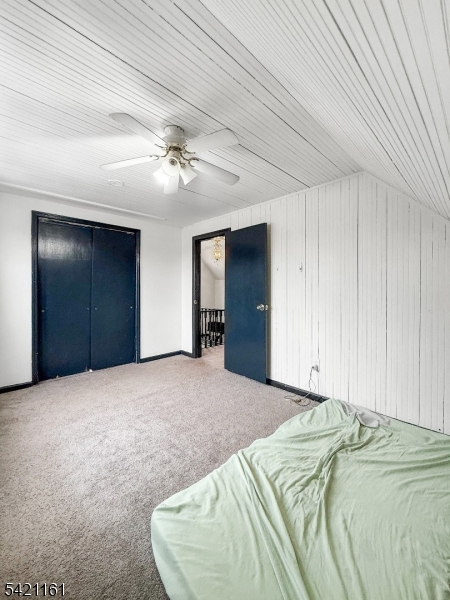 66 Washington Place East Rutherford, NJ 07073 - Photo 13 of 35 a bed room with a bed and a ceiling fan