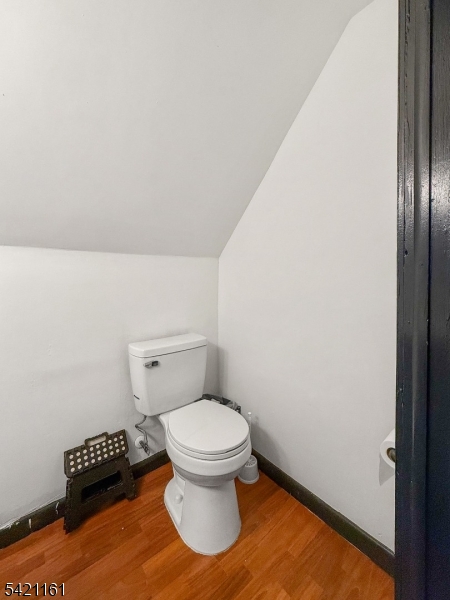 66 Washington Place East Rutherford, NJ 07073 - Photo 16 of 35 a bathroom with a toilet and a chair