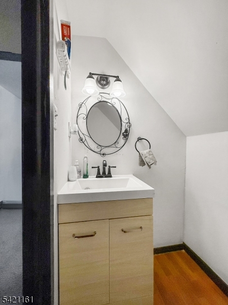 66 Washington Place East Rutherford, NJ 07073 - Photo 17 of 35 a bathroom with a granite countertop sink and a mirror