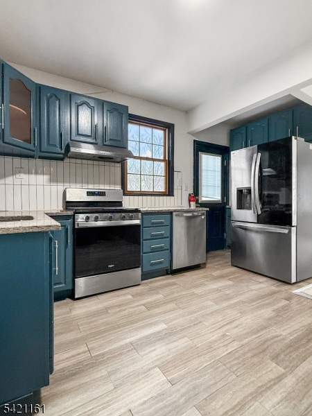 66 Washington Place East Rutherford, NJ 07073 - Photo 21 of 35 a kitchen with stainless steel appliances granite countertop a stove top oven and sink