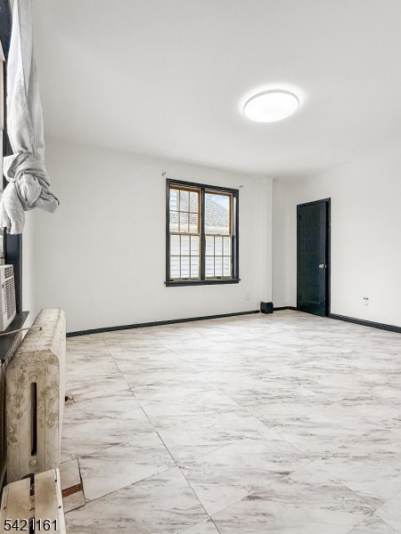 66 Washington Place East Rutherford, NJ 07073 - Photo 23 of 35 a view of an empty room with a window