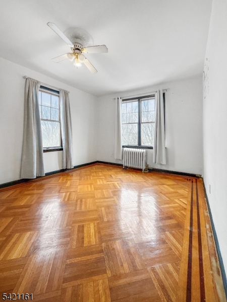 66 Washington Place East Rutherford, NJ 07073 - Photo 3 of 35 wooden floor in an empty room with a window
