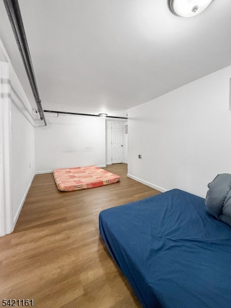 66 Washington Place East Rutherford, NJ 07073 - Photo 7 of 35 a bedroom with a bed and a table