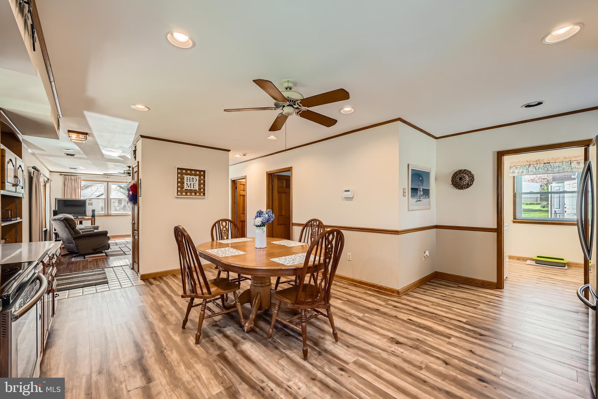 1722 Anne Avenue Baltimore, MD 21221 - Photo 11 of 28 a view of a dining room with furniture and wooden floor