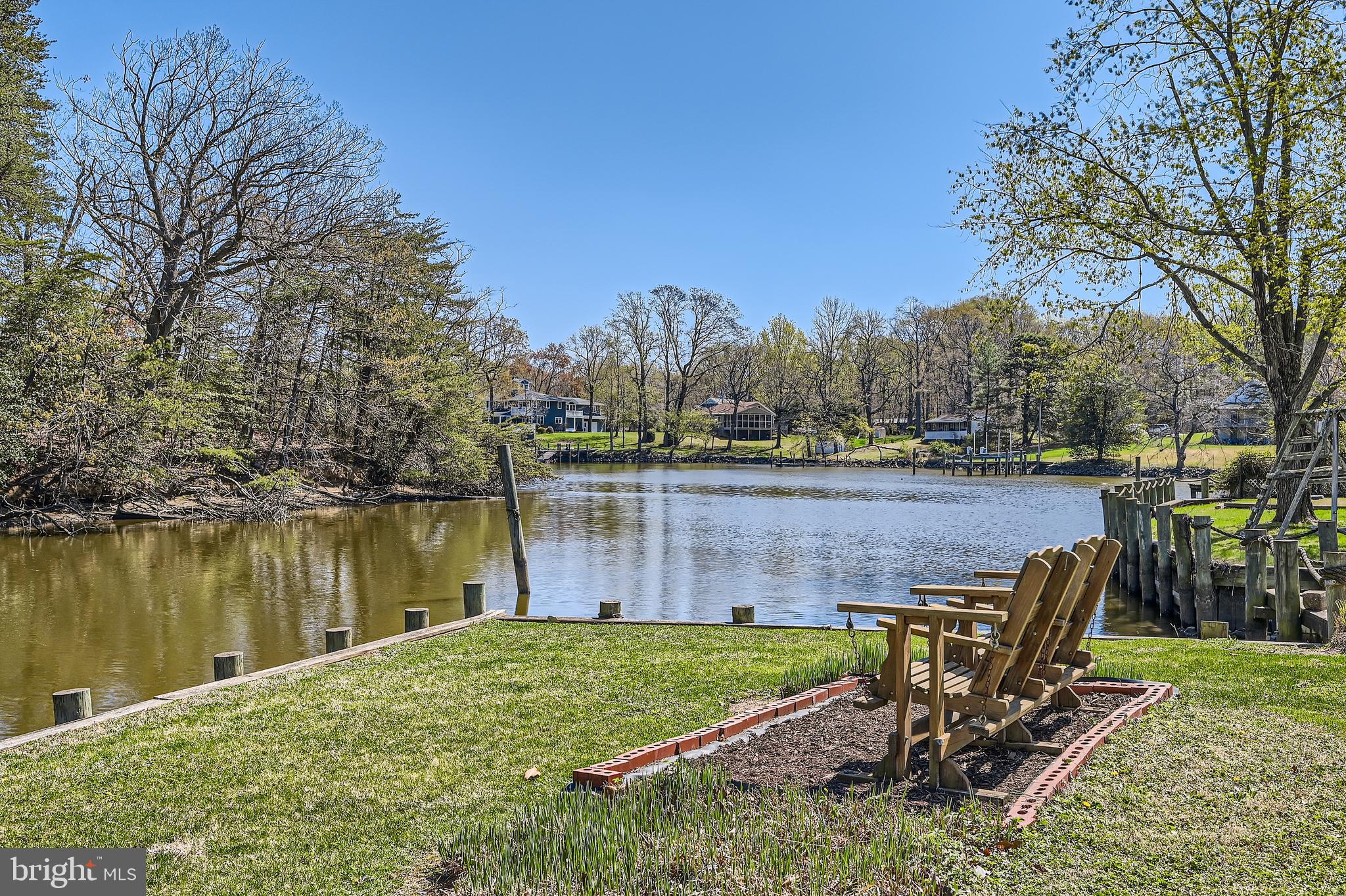 1722 Anne Avenue Baltimore, MD 21221 - Photo 4 of 28 a view of a lake with a table and chairs
