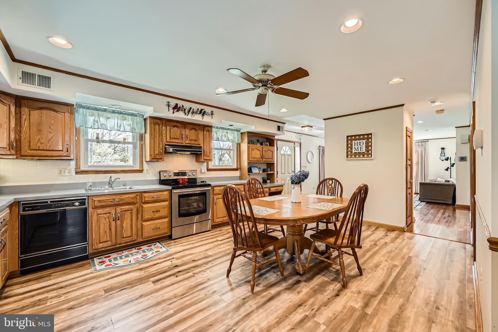 1722 Anne Avenue Baltimore, MD 21221 - Photo 10 of 28 a view of a dining room with furniture window and wooden floor