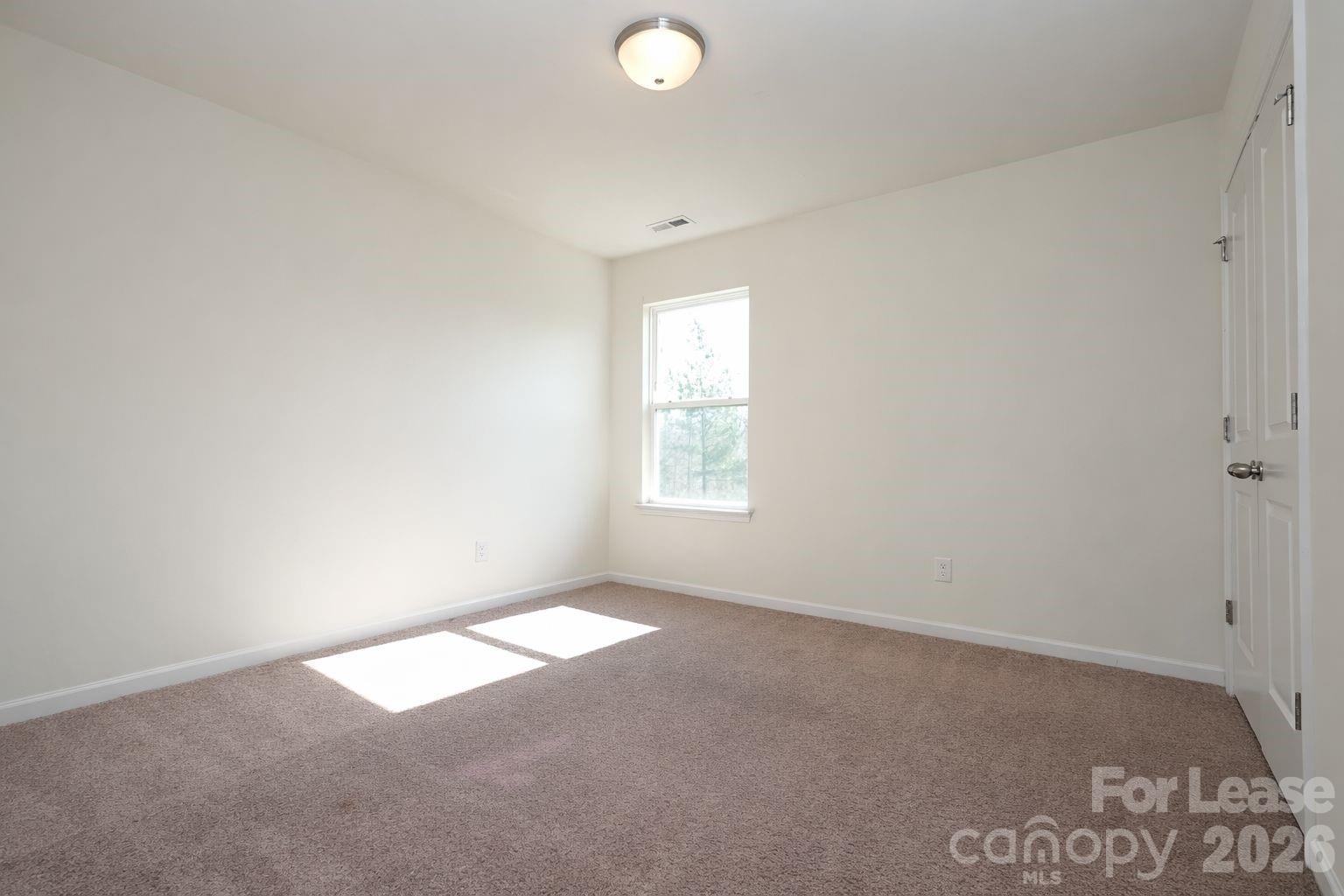 3220 Berry Creek Road Charlotte, NC 28214 - Photo 25 of 41 an empty room with windows