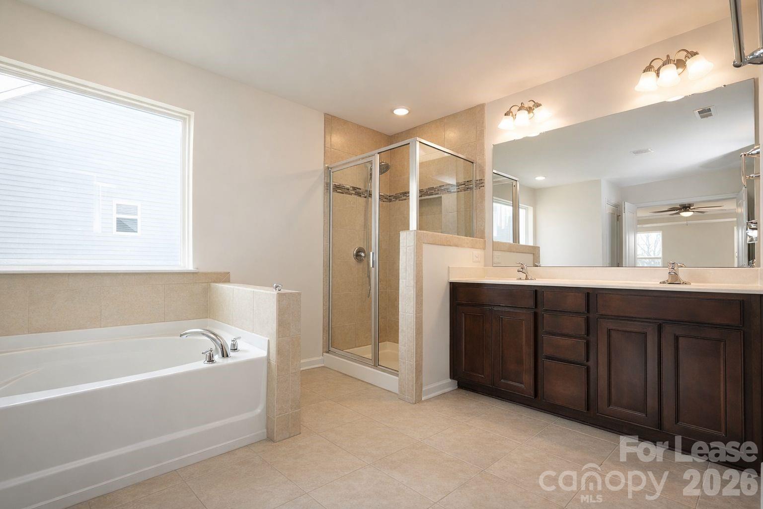 3220 Berry Creek Road Charlotte, NC 28214 - Photo 30 of 41 a bathroom with a bathtub shower sink and mirror