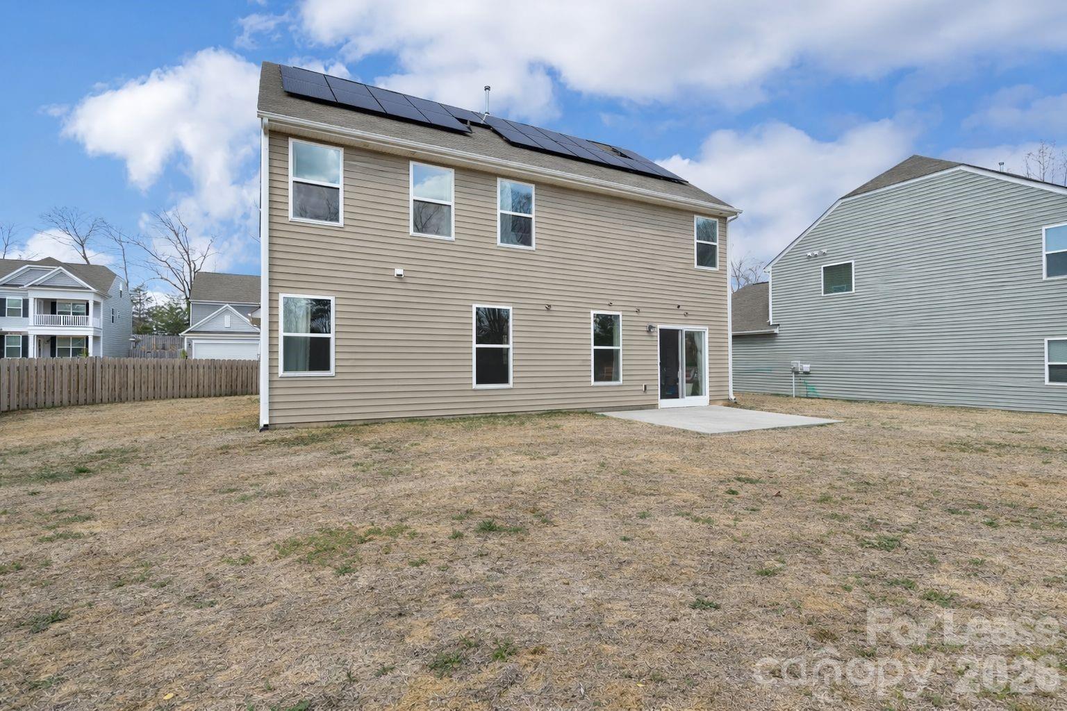 3220 Berry Creek Road Charlotte, NC 28214 - Photo 36 of 41 a view of a house with backyard and a tree