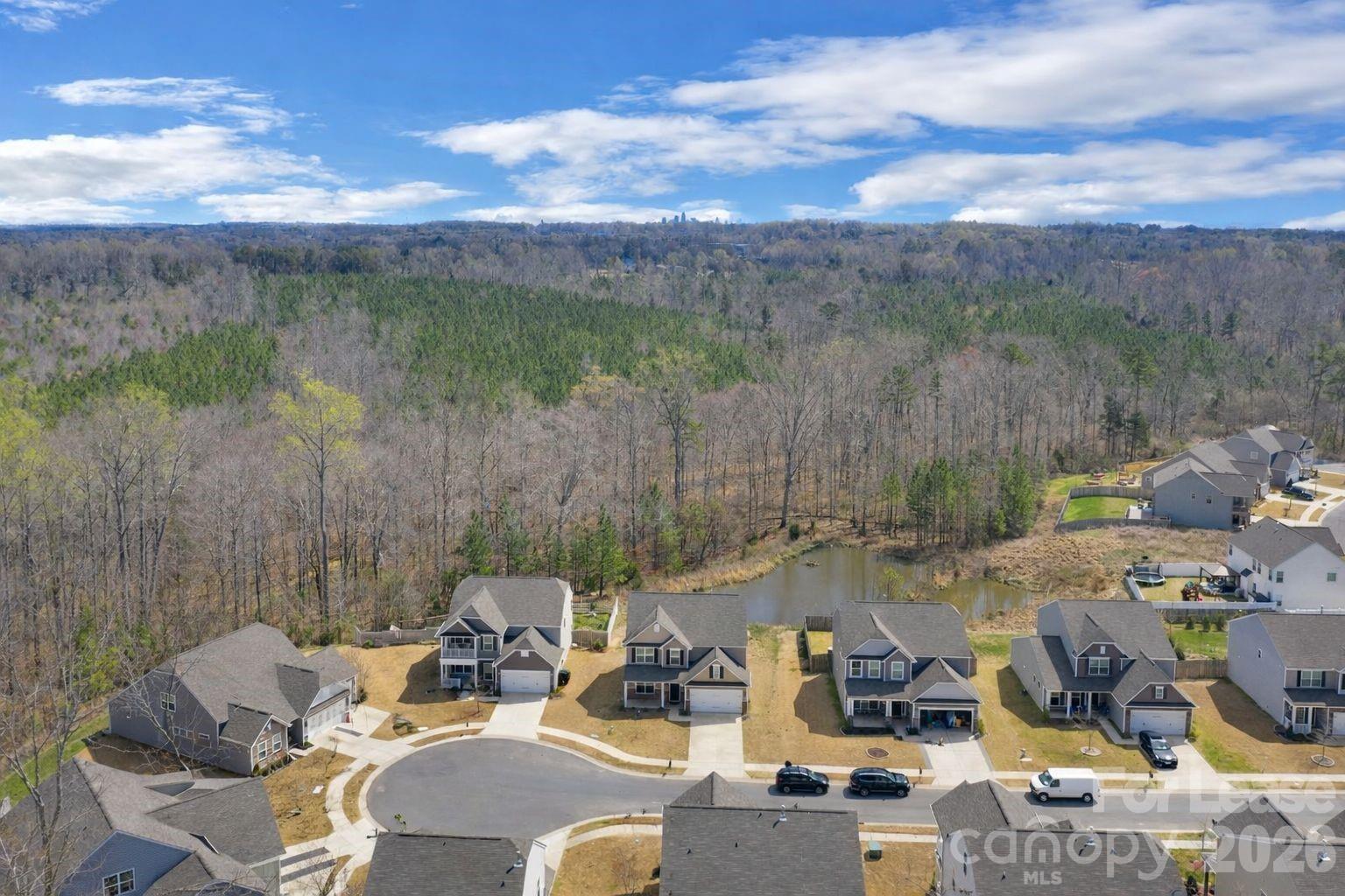 3220 Berry Creek Road Charlotte, NC 28214 - Photo 39 of 41 a view of a lake with couches chairs