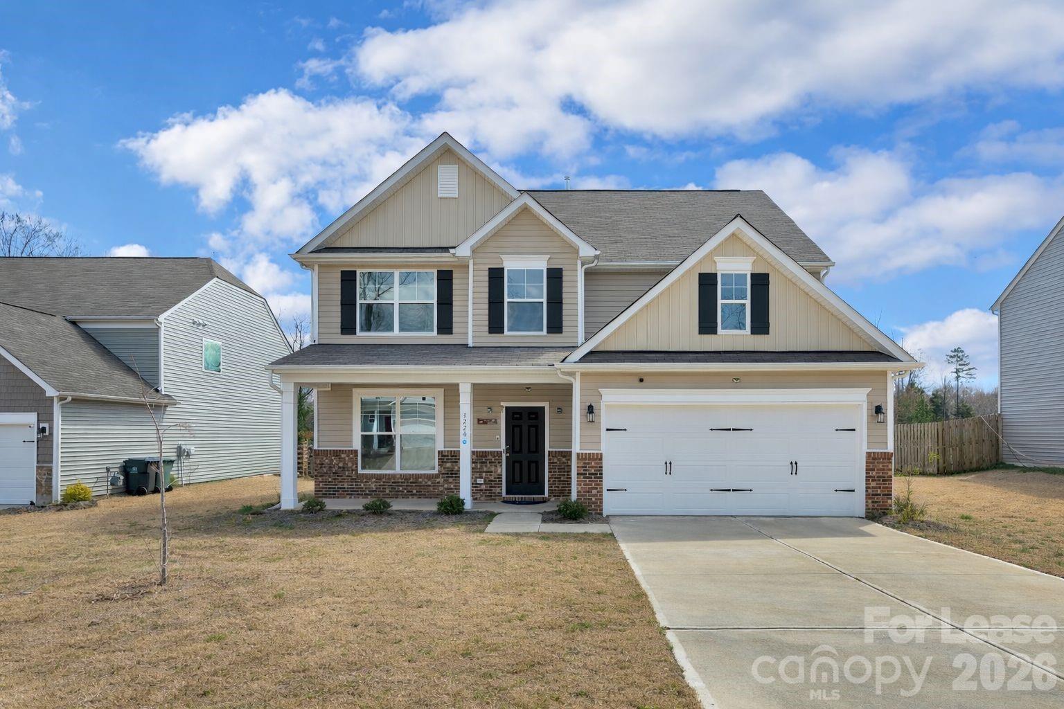 3220 Berry Creek Road Charlotte, NC 28214 - Photo 5 of 41 front view of a house with a yard