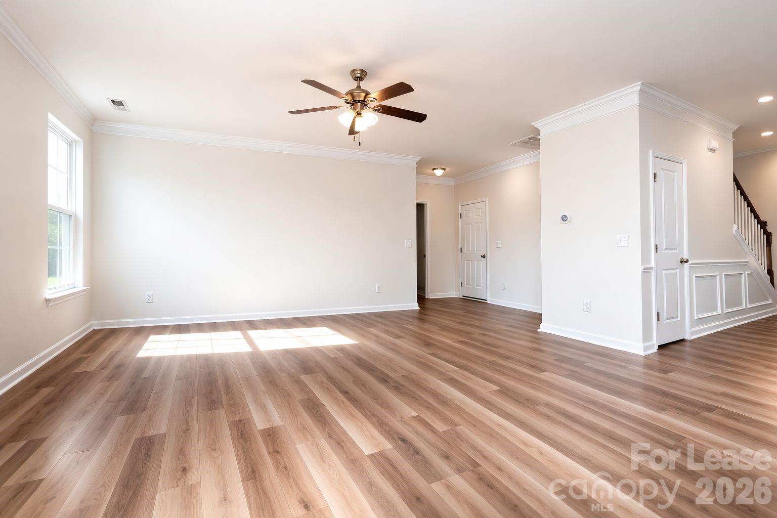 3220 Berry Creek Road Charlotte, NC 28214 - Photo 9 of 41 wooden floor in an empty room with a window
