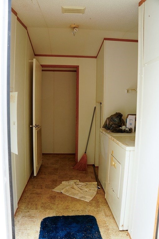 550 North Raymond Road La Grange, TX 78945 - Photo 16 of 28 a bedroom with a bed and a cabinets