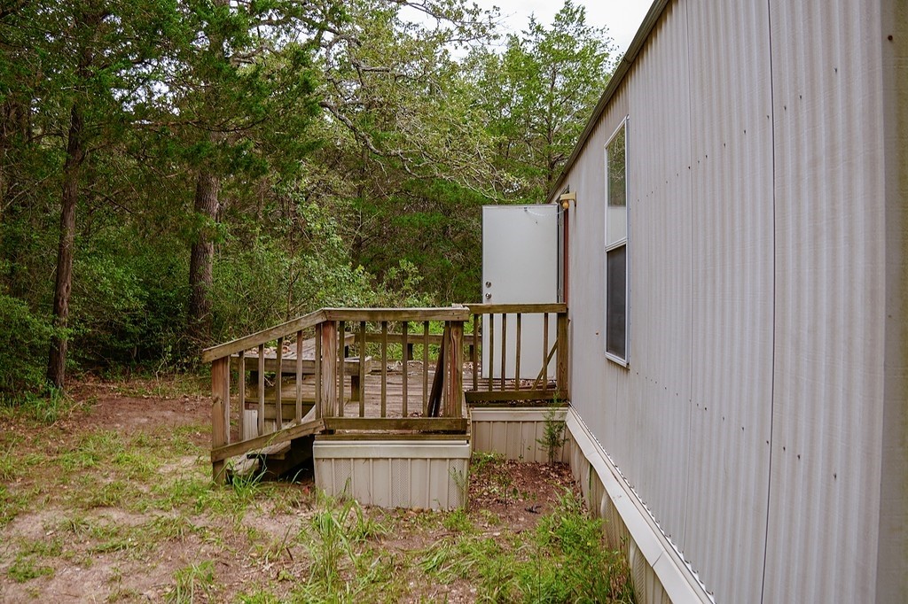 550 North Raymond Road La Grange, TX 78945 - Photo 17 of 28 a view of a balcony with wooden floor and fence