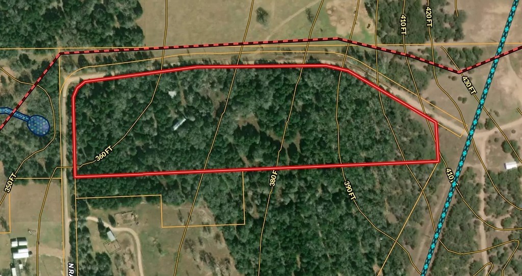 550 North Raymond Road La Grange, TX 78945 - Photo 2 of 28 a view of a balcony with floor to ceiling windows