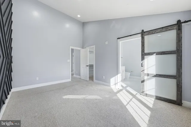 a view of a room with a refrigerator