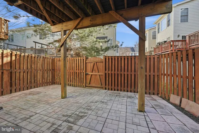 a view of small space with wooden fence