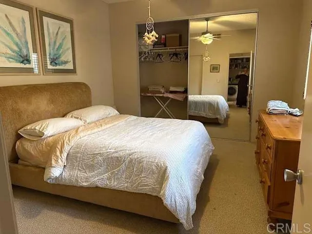 a bedroom with a bed and dresser