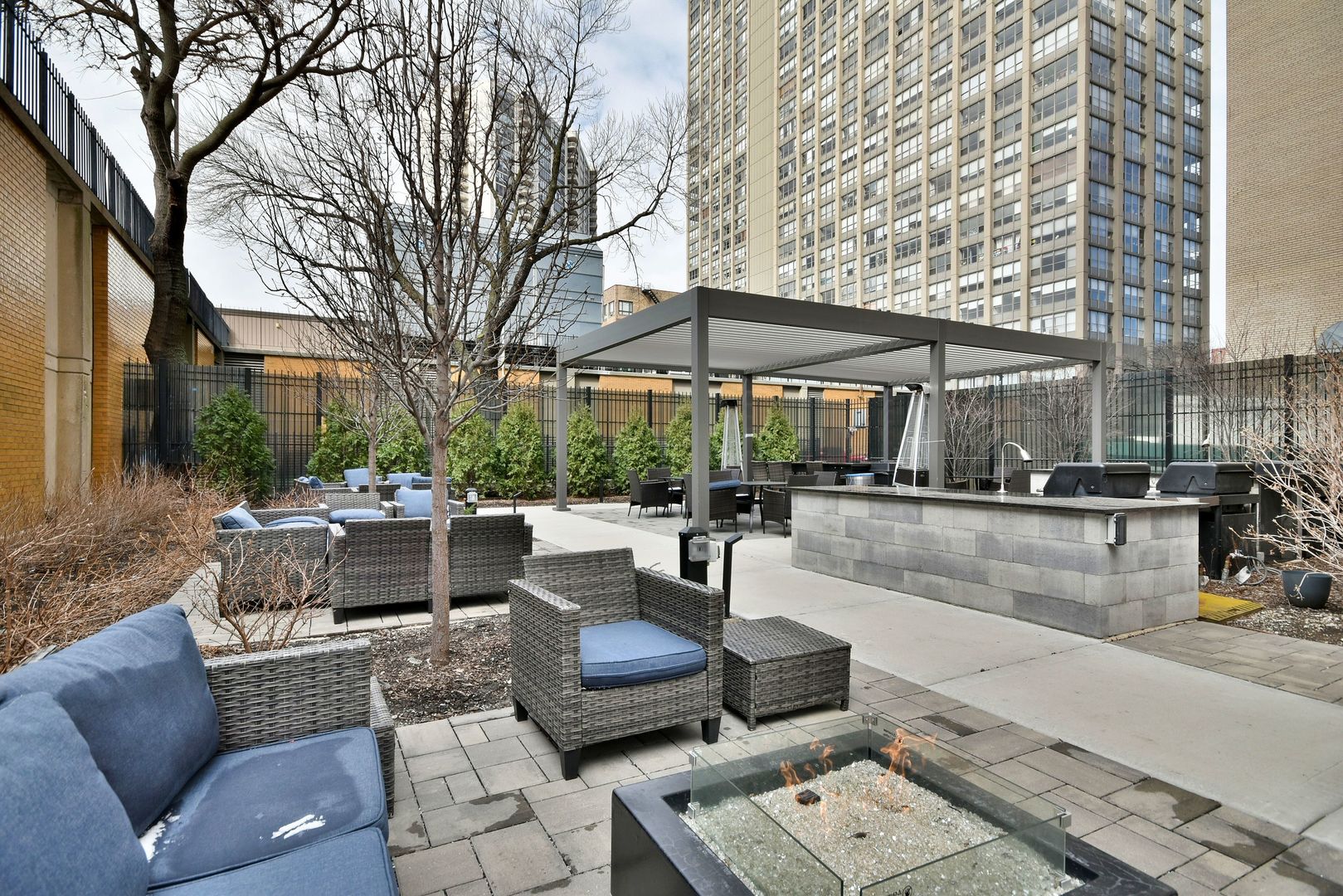 3950 North Lake Shore Drive, Unit 1202 Chicago, IL 60613 - Photo 27 of 32 a view of a patio with couches and a fire pit