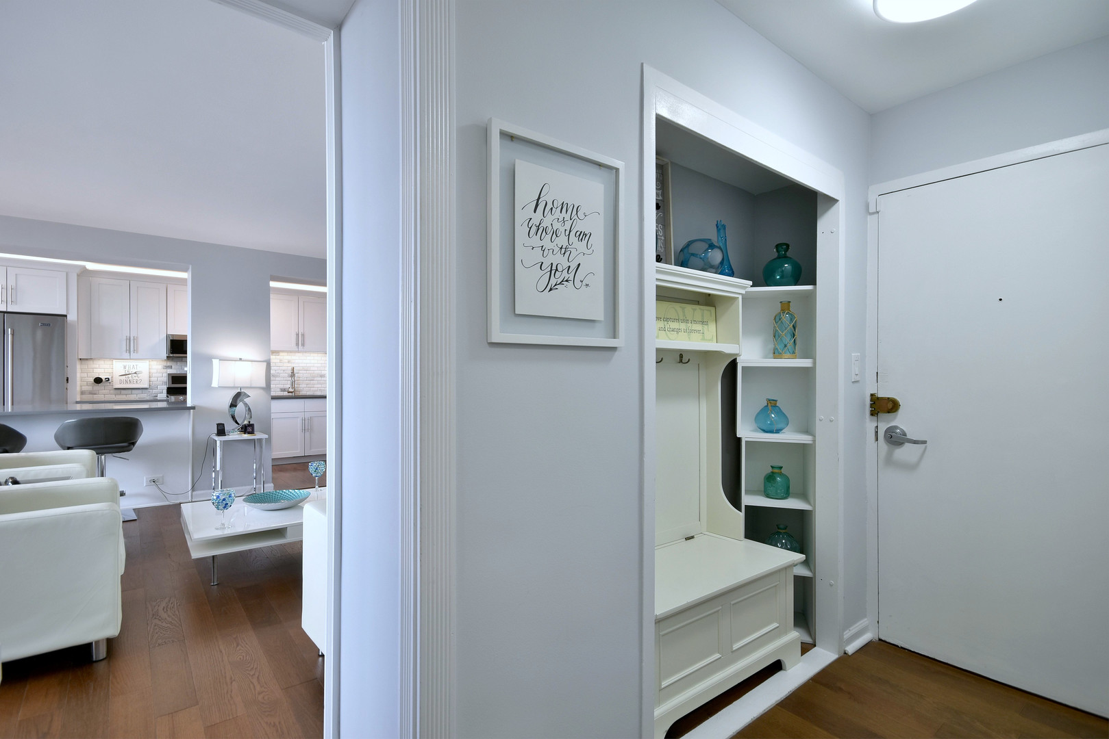 3950 North Lake Shore Drive, Unit 1202 Chicago, IL 60613 - Photo 4 of 32 a living room with furniture and a table