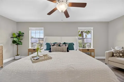 a bedroom with furniture and a window