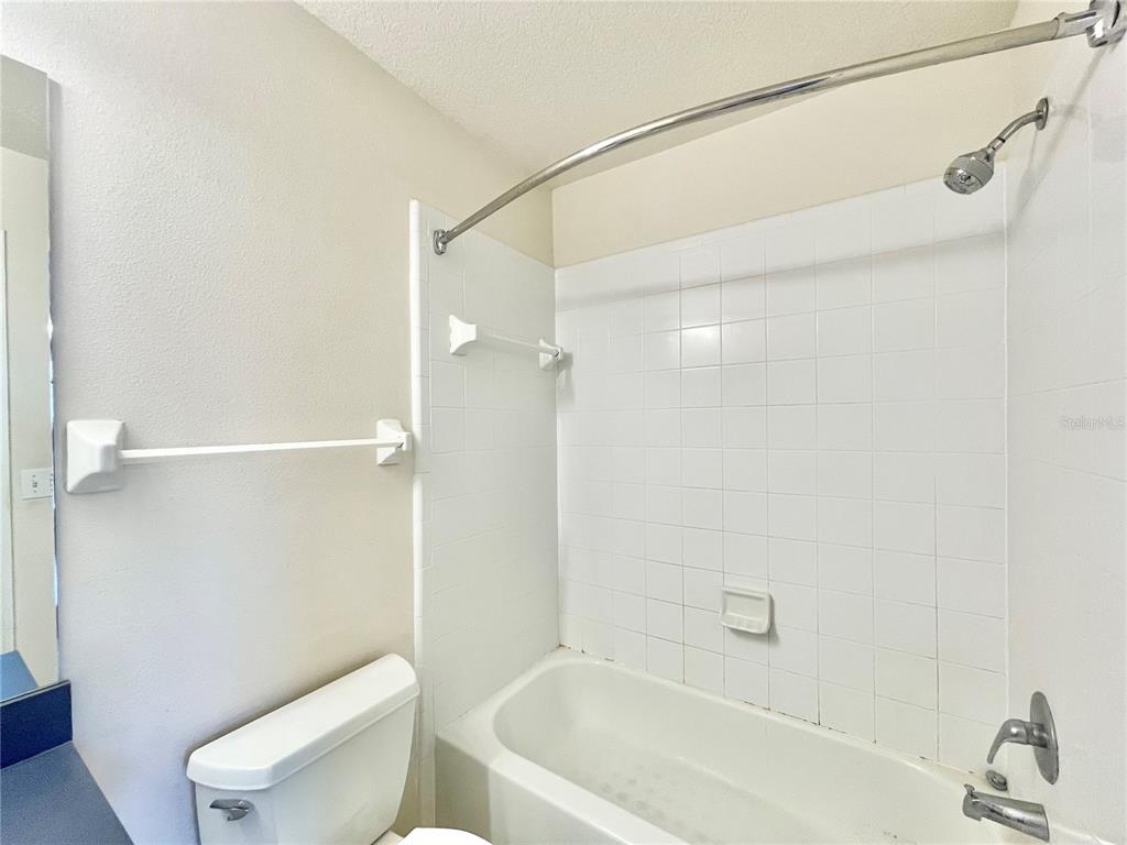 2348 Southwest 42nd Drive, Unit 151 Gainesville, FL 32607 - Photo 15 of 28 a bathroom with a bathtub and a toilet