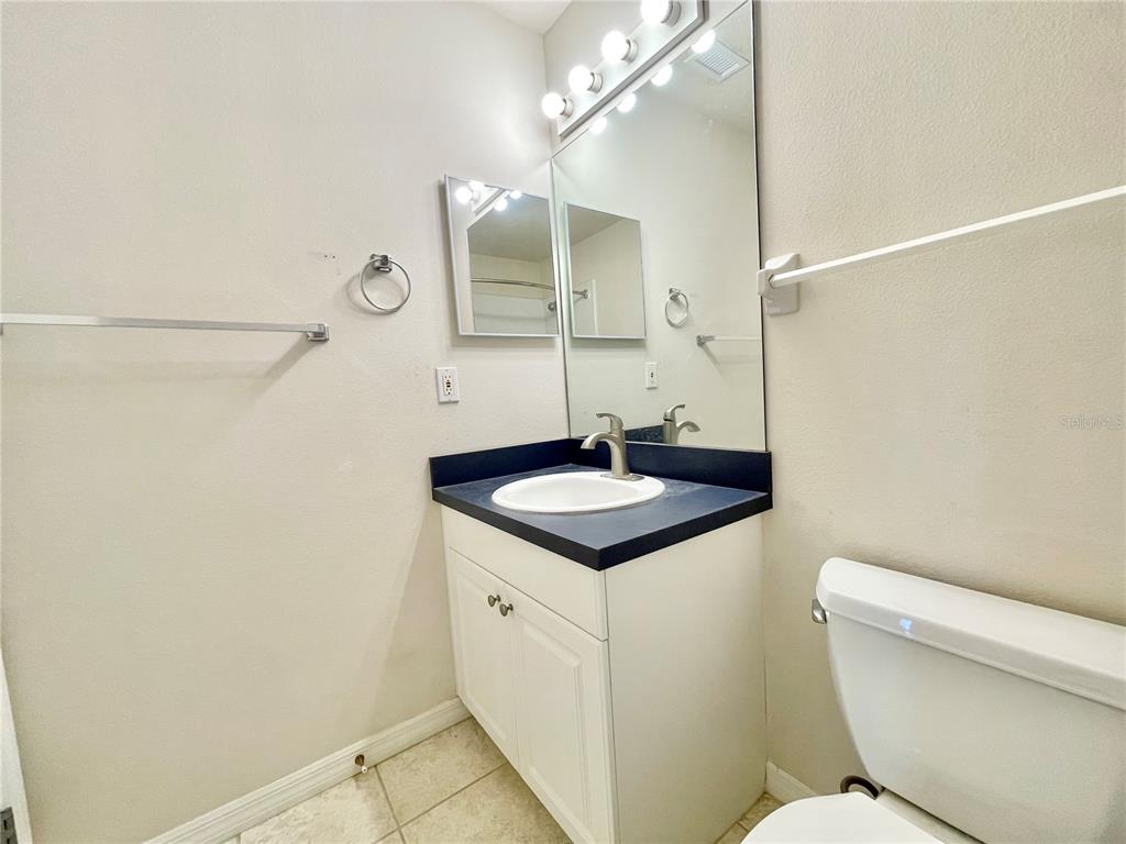 2348 Southwest 42nd Drive, Unit 151 Gainesville, FL 32607 - Photo 16 of 28 a bathroom with a sink a toilet and shower