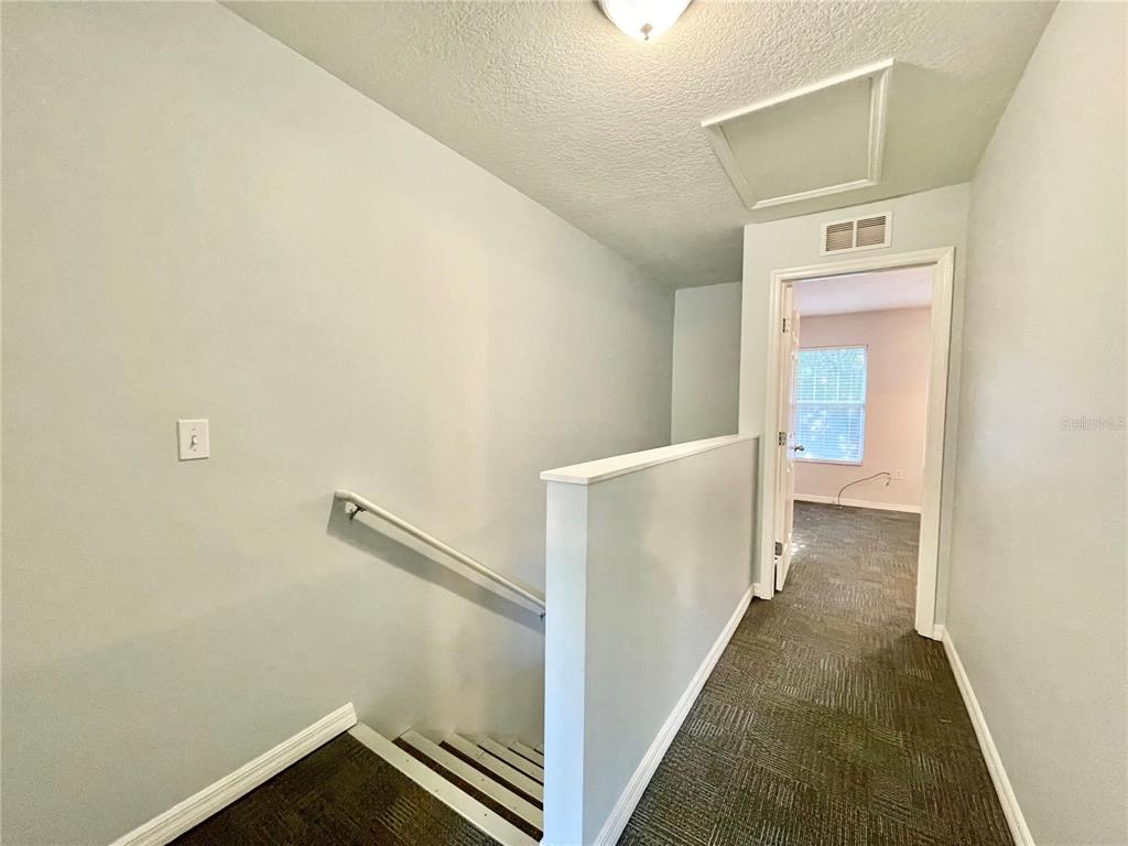 2348 Southwest 42nd Drive, Unit 151 Gainesville, FL 32607 - Photo 17 of 28 a view of a hallway with hallway