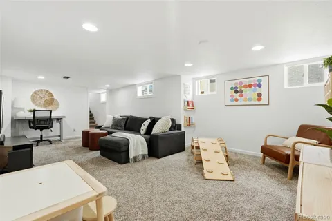 a bedroom with a bed and a television
