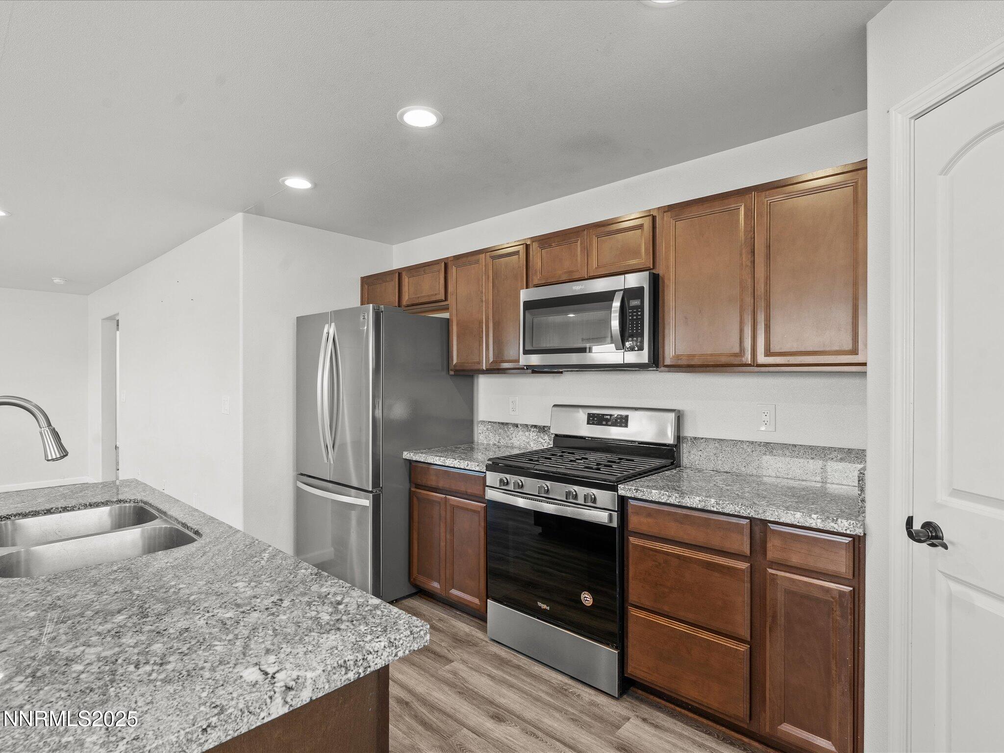2041 Verona Drive Fallon, NV 89406 - Photo 13 of 45 a kitchen with a sink stove and refrigerator