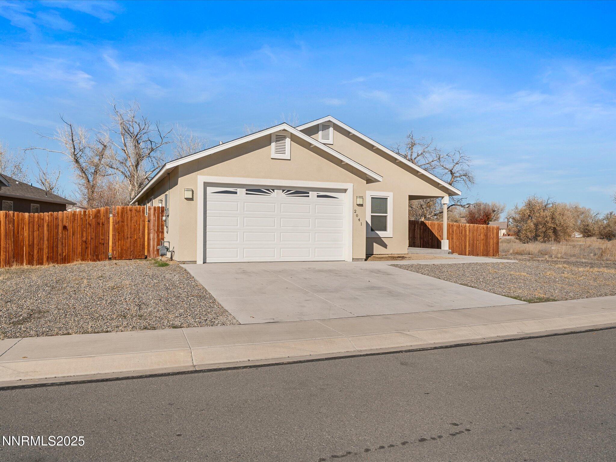 2041 Verona Drive Fallon, NV 89406 - Photo 2 of 45 a front view of a house with a garage