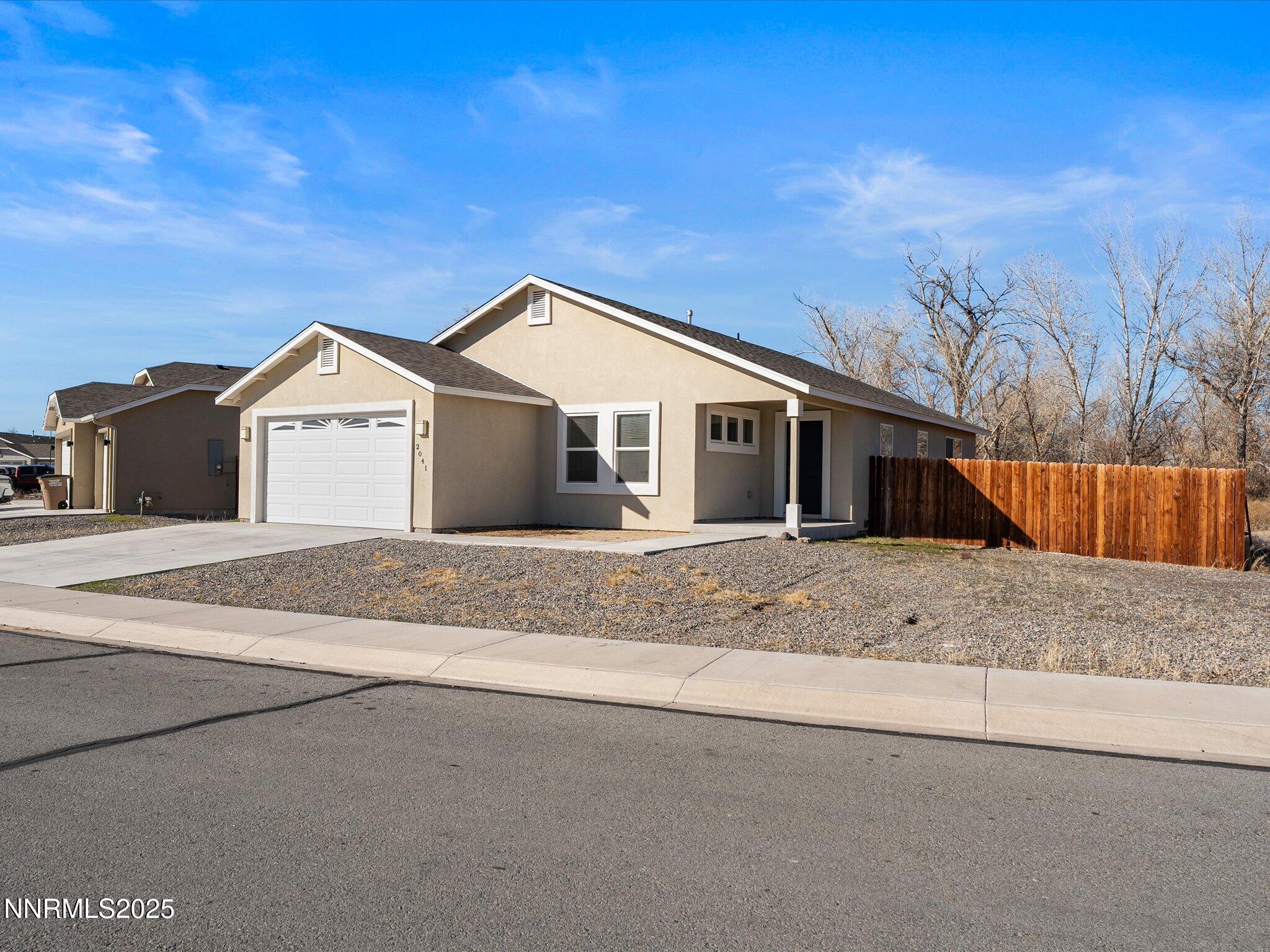 2041 Verona Drive Fallon, NV 89406 - Photo 3 of 45 a front view of a house with a yard