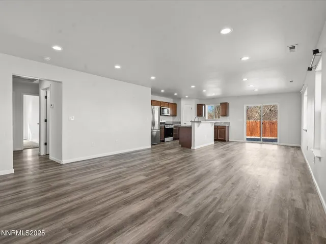 a view of a kitchen with a sink and a stove top oven